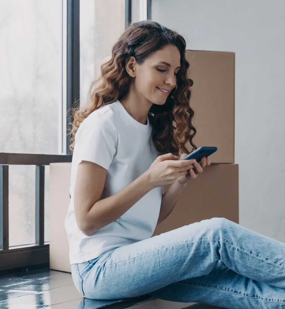 happy girl using smartphone while moving